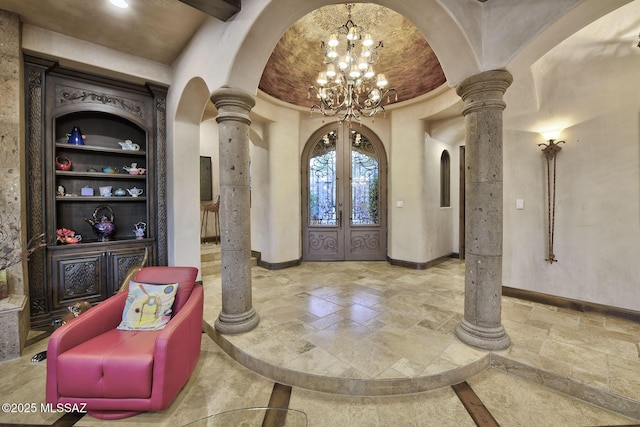 6015 N Camino Preciado, Tucson, AZ 85718 - entryway featuring ornate columns, stone tile flooring, and arched walkways