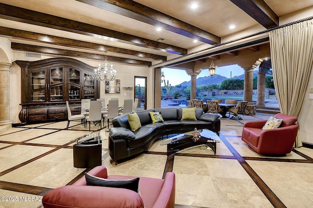 6015 N Camino Preciado, Tucson, AZ 85718 - living room with inlaid floor details, a mountain view, beamed ceiling, ornate columns, and a chandelier