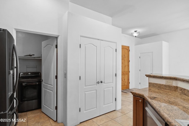 385 E Cedarvale Rd, Tucson, AZ 85704 - kitchen featuring stainless steel appliances, light tile patterned floors, and light stone countertops