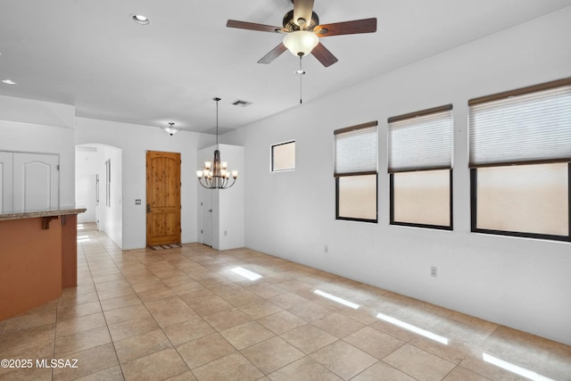 385 E Cedarvale Rd, Tucson, AZ 85704 - spare room with light tile patterned floors, a chandelier, a ceiling fan, arched walkways, and recessed lighting