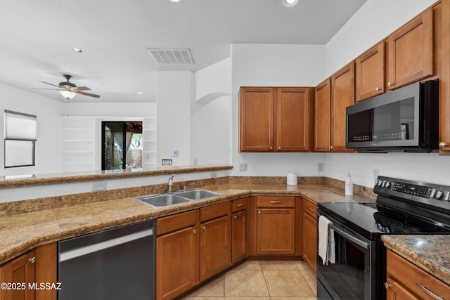 385 E Cedarvale Rd, Tucson, AZ 85704 - kitchen featuring dishwasher, electric range, brown cabinetry, light tile patterned flooring, and recessed lighting