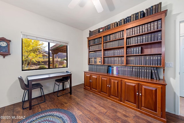 office with dark wood-type flooring, ceiling fan, and baseboards