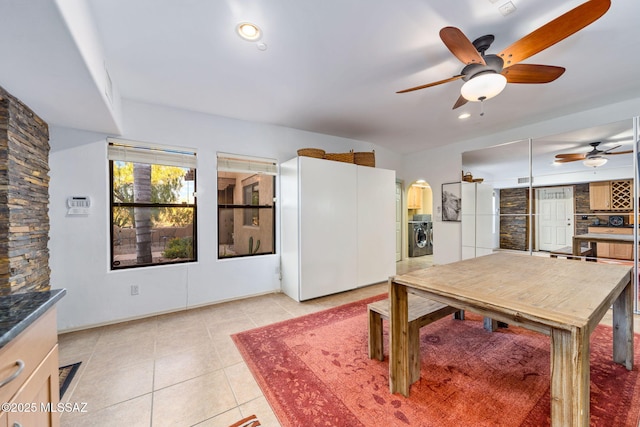 kitchen with a ceiling fan, light tile patterned floors, washer / dryer, and recessed lighting