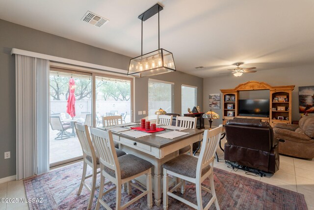711 W Camino Del Rosal, Sahuarita, AZ 85629 - dining area featuring light tile patterned floors, ceiling fan, and baseboards