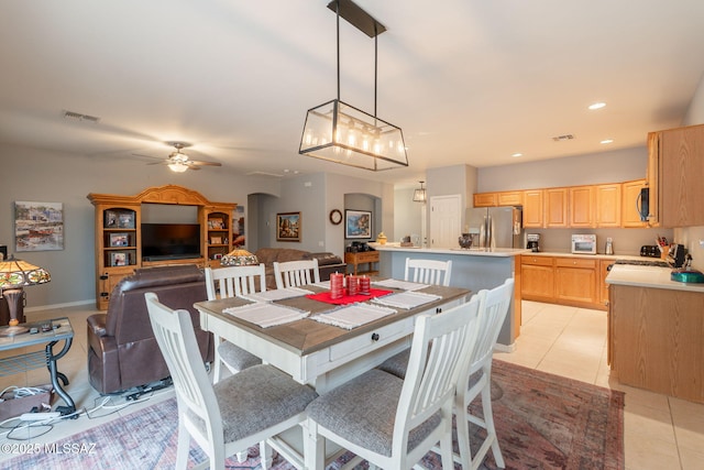 711 W Camino Del Rosal, Sahuarita, AZ 85629 - dining area with arched walkways, ceiling fan, light tile patterned floors, recessed lighting, and baseboards
