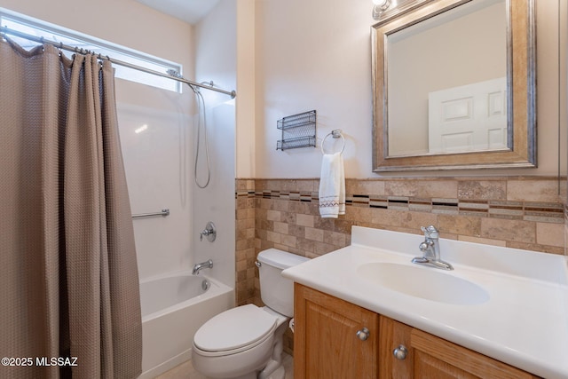 711 W Camino Del Rosal, Sahuarita, AZ 85629 - bathroom featuring tile walls, shower / bathtub combination with curtain, toilet, vanity, and wainscoting