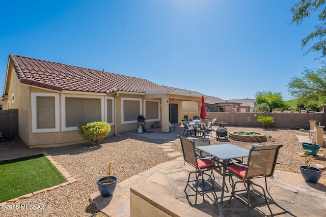 711 W Camino Del Rosal, Sahuarita, AZ 85629 - view of patio with outdoor dining area and a fenced backyard