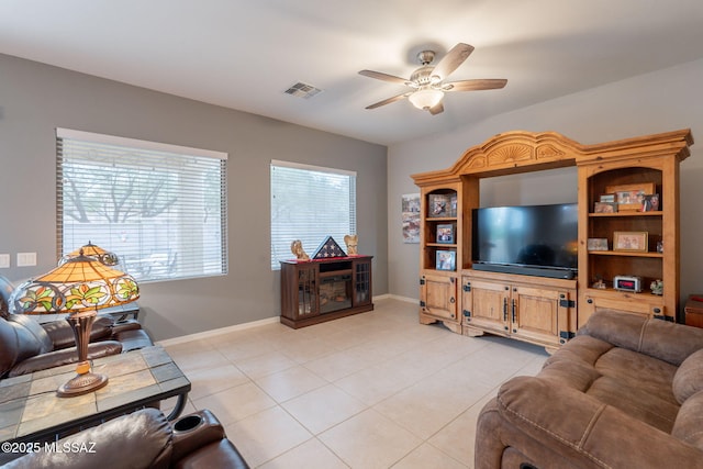 711 W Camino Del Rosal, Sahuarita, AZ 85629 - living area with ceiling fan, light tile patterned floors, and baseboards