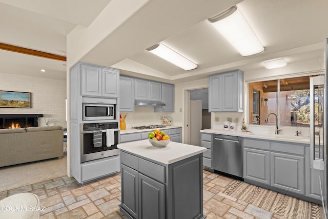 6891 N Camino Verde, Tucson, AZ 85743 - kitchen with appliances with stainless steel finishes, gray cabinets, brick patterned floor, and a sink