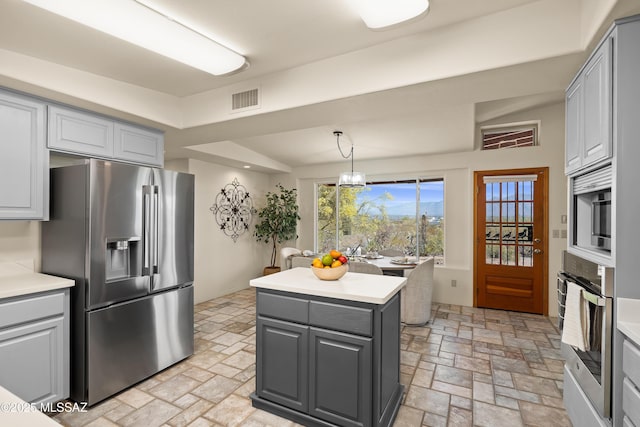 6891 N Camino Verde, Tucson, AZ 85743 - kitchen featuring visible vents, gray cabinets, and appliances with stainless steel finishes