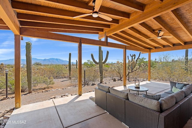 6891 N Camino Verde, Tucson, AZ 85743 - view of patio / terrace with outdoor lounge area, a ceiling fan, and a mountain view