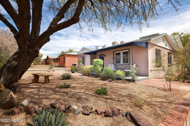 1700 E Water St, Tucson, AZ 85719 - view of front of house featuring brick siding and a chimney