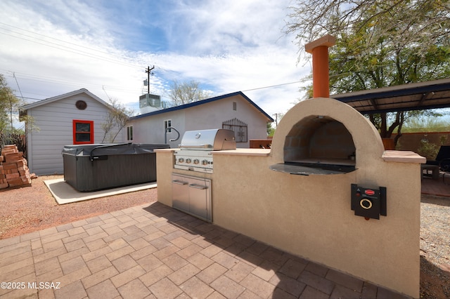 1700 E Water St, Tucson, AZ 85719 - view of patio with a grill, exterior kitchen, and a hot tub