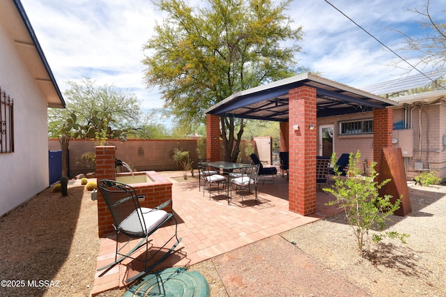 1700 E Water St, Tucson, AZ 85719 - view of patio featuring a gazebo, outdoor dining space, and a fenced backyard