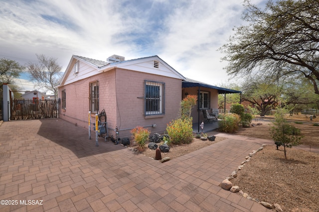 1700 E Water St, Tucson, AZ 85719 - view of front of home featuring brick siding and fence