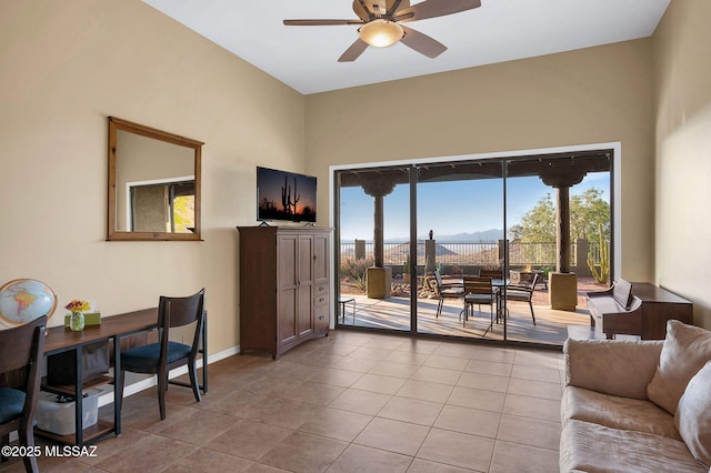 17950 S Via El Caballo Prieto, Vail, AZ 85641 - living room featuring ceiling fan, light tile patterned floors, baseboards, and a towering ceiling