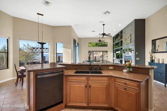 17950 S Via El Caballo Prieto, Vail, AZ 85641 - kitchen featuring stainless steel dishwasher, a sink, ceiling fan, light tile patterned flooring, and brown cabinets