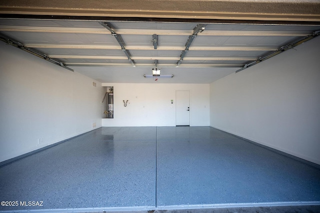 37 W Corte Perla Fina, Sahuarita, AZ 85629 - garage with baseboards and water heater