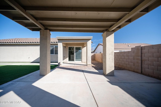 37 W Corte Perla Fina, Sahuarita, AZ 85629 - view of patio featuring an outdoor stone fireplace and a fenced backyard