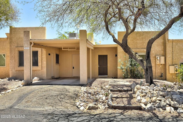 4640 E Via Pimeria Alta, Tucson, AZ 85718 - pueblo revival-style home with a chimney and stucco siding
