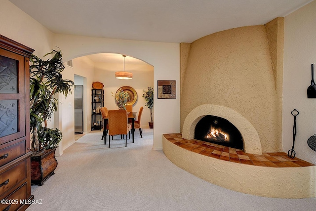 4640 E Via Pimeria Alta, Tucson, AZ 85718 - living room featuring arched walkways and carpet flooring