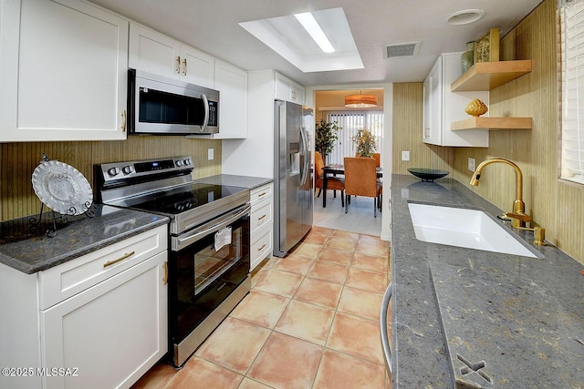 4640 E Via Pimeria Alta, Tucson, AZ 85718 - kitchen with stainless steel appliances, a sink, open shelves, white cabinets, and light tile patterned floors