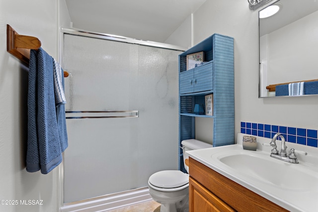 7634 E Apple Tree Dr, Tucson, AZ 85730 - bathroom featuring toilet, a stall shower, vanity, and backsplash