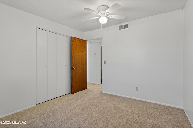 7634 E Apple Tree Dr, Tucson, AZ 85730 - unfurnished bedroom with carpet, baseboards, and a closet