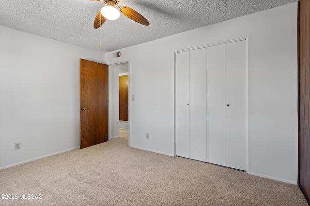 7634 E Apple Tree Dr, Tucson, AZ 85730 - unfurnished bedroom featuring carpet flooring, a textured ceiling, a closet, baseboards, and ceiling fan