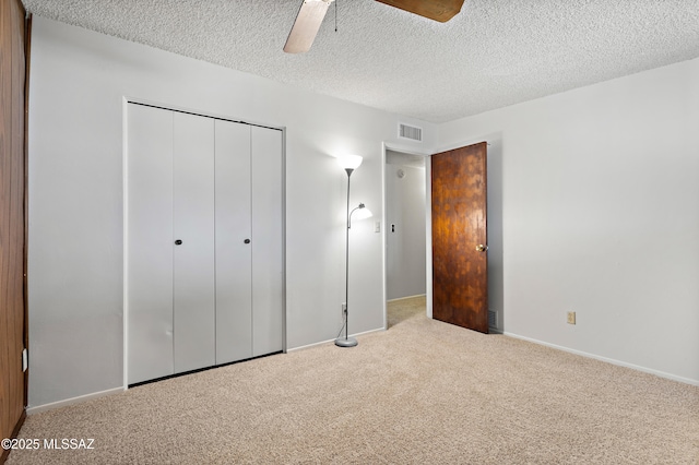 7634 E Apple Tree Dr, Tucson, AZ 85730 - unfurnished bedroom featuring carpet floors, a closet, a textured ceiling, a ceiling fan, and baseboards