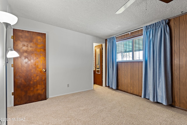7634 E Apple Tree Dr, Tucson, AZ 85730 - spare room with a ceiling fan, carpet floors, a textured ceiling, and baseboards
