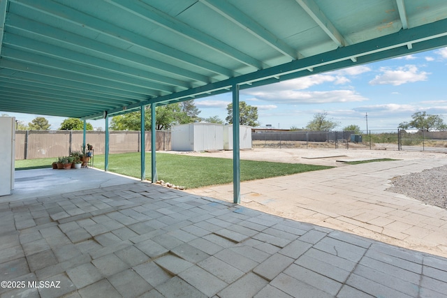 7634 E Apple Tree Dr, Tucson, AZ 85730 - view of patio featuring a shed and an outdoor structure