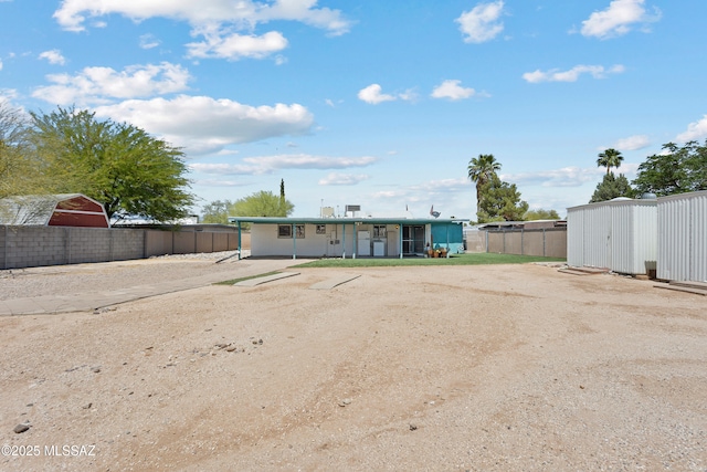 7634 E Apple Tree Dr, Tucson, AZ 85730 - rear view of house with fence