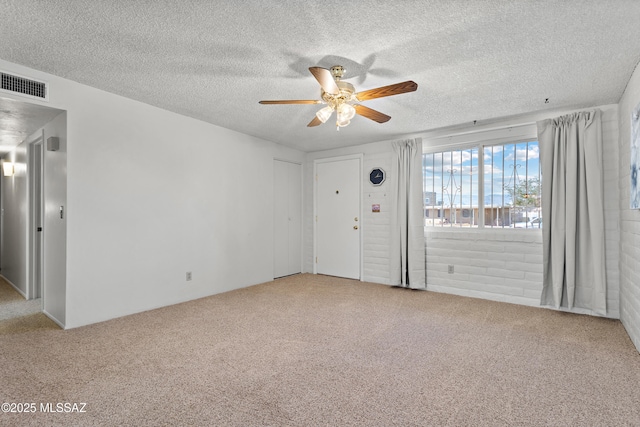7634 E Apple Tree Dr, Tucson, AZ 85730 - spare room with ceiling fan, carpet floors, and a textured ceiling