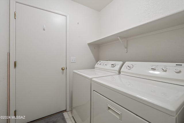 9410 E Grapevine Spring Pl, Tucson, AZ 85710 - washroom with laundry area, independent washer and dryer, and light tile patterned floors