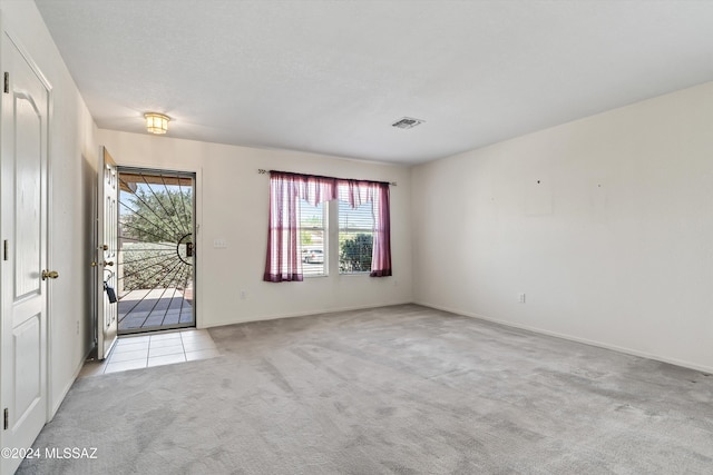 9410 E Grapevine Spring Pl, Tucson, AZ 85710 - carpeted spare room with visible vents and baseboards