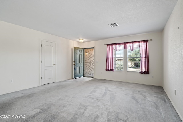 9410 E Grapevine Spring Pl, Tucson, AZ 85710 - spare room featuring carpet and visible vents
