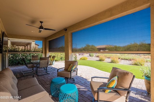 view of patio with ceiling fan and outdoor dining area