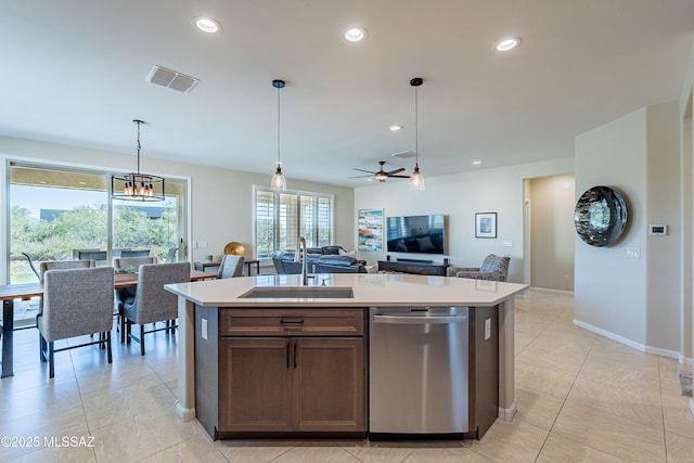 kitchen with dishwasher, a sink, light countertops, a ceiling fan, and open floor plan