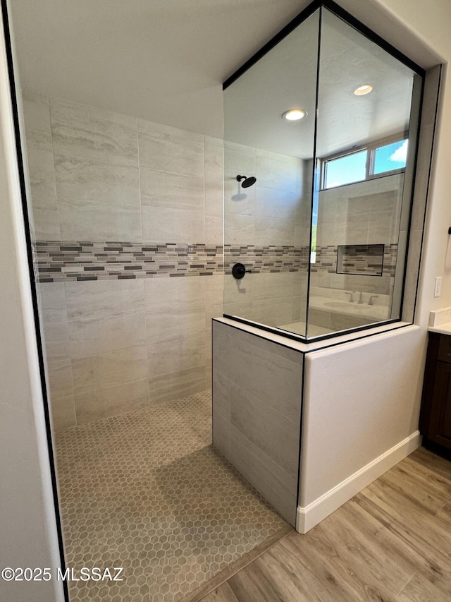 61662 E Quartzite Rd, Oracle, AZ 85623 - bathroom featuring wood finished floors, a walk in shower, vanity, recessed lighting, and baseboards