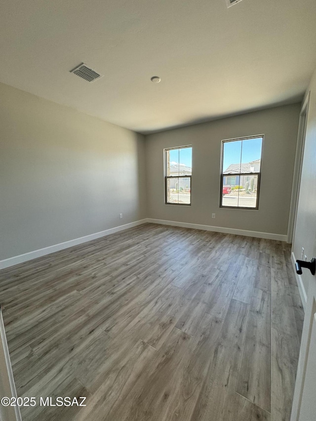 61662 E Quartzite Rd, Oracle, AZ 85623 - empty room with wood finished floors and baseboards