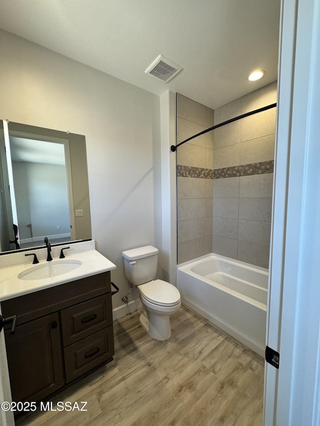61662 E Quartzite Rd, Oracle, AZ 85623 - full bath with toilet, wood finished floors, vanity, bathtub / shower combination, and recessed lighting