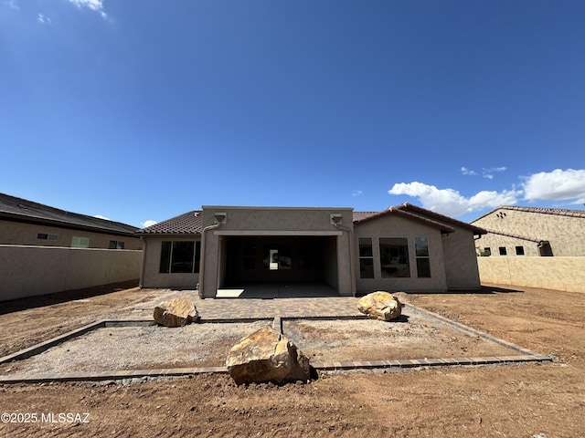 61662 E Quartzite Rd, Oracle, AZ 85623 - rear view of house featuring a patio area, fence, stucco siding, and a tile roof