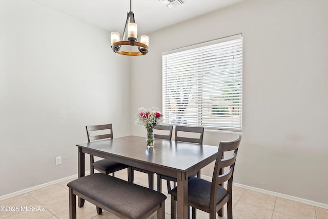 5523 W Carriage Dr, Tucson, AZ 85742 - dining space with a chandelier, light tile patterned floors, and baseboards
