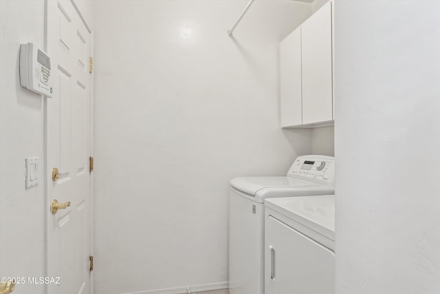 5523 W Carriage Dr, Tucson, AZ 85742 - laundry room with cabinet space and washer and dryer