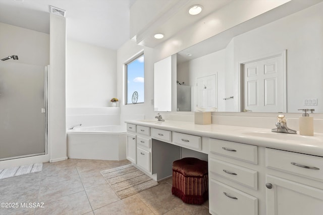 5523 W Carriage Dr, Tucson, AZ 85742 - bathroom with double vanity, a bath, a shower stall, and tile patterned flooring