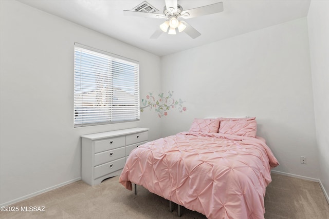 5523 W Carriage Dr, Tucson, AZ 85742 - bedroom featuring light carpet, baseboards, and a ceiling fan