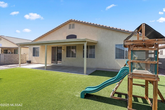 5523 W Carriage Dr, Tucson, AZ 85742 - rear view of house with a playground, stucco siding, a patio area, and a tile roof
