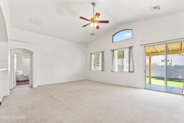 5523 W Carriage Dr, Tucson, AZ 85742 - unfurnished room featuring vaulted ceiling, light carpet, ceiling fan, and arched walkways