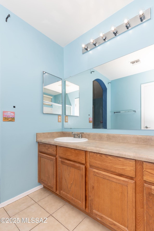 6591 S Avenida Santa Carolina, Tucson, AZ 85756 - bathroom featuring tile patterned floors, vanity, and baseboards